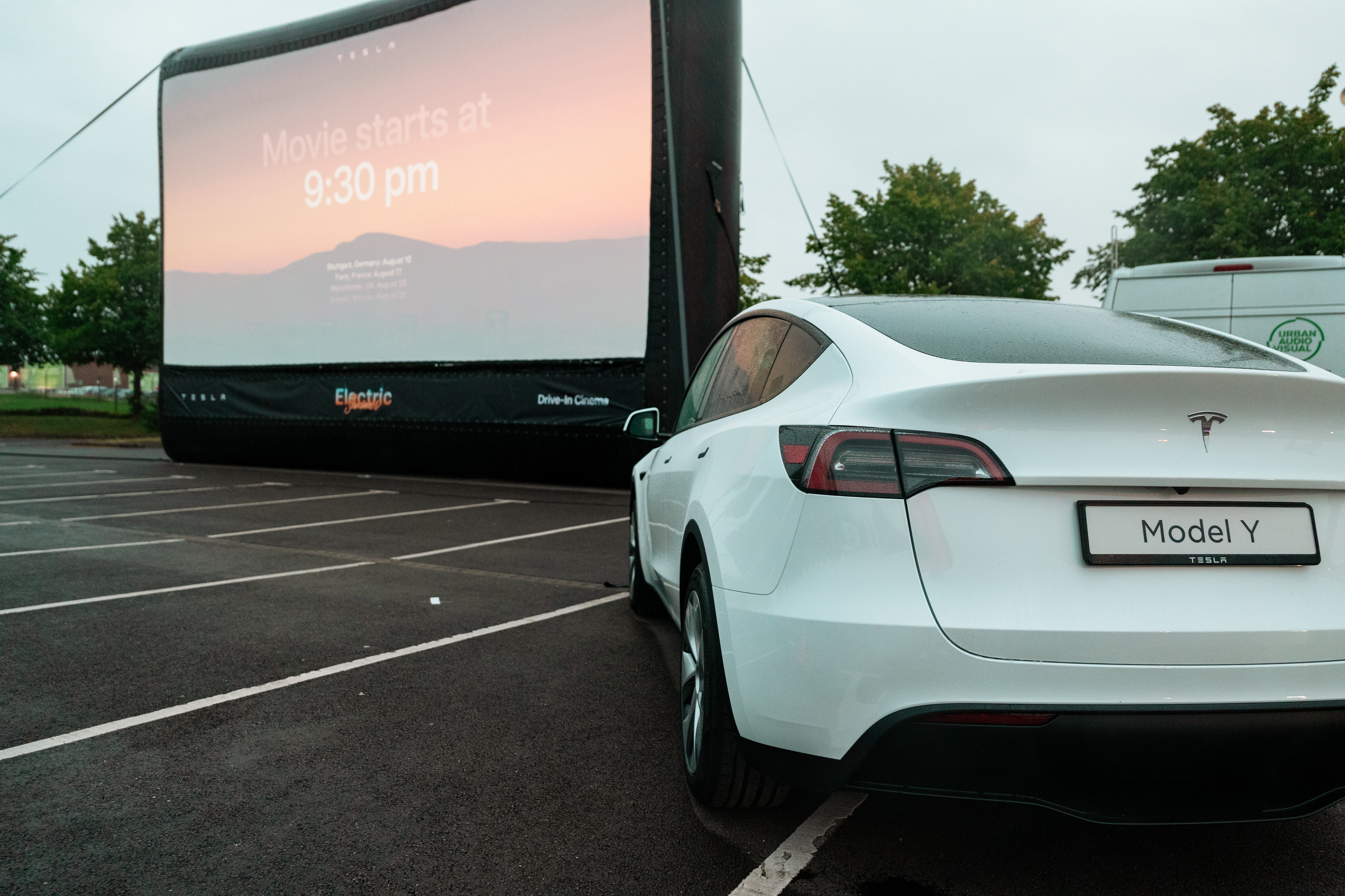 Drive in cinema with urban entertainment and Tesla